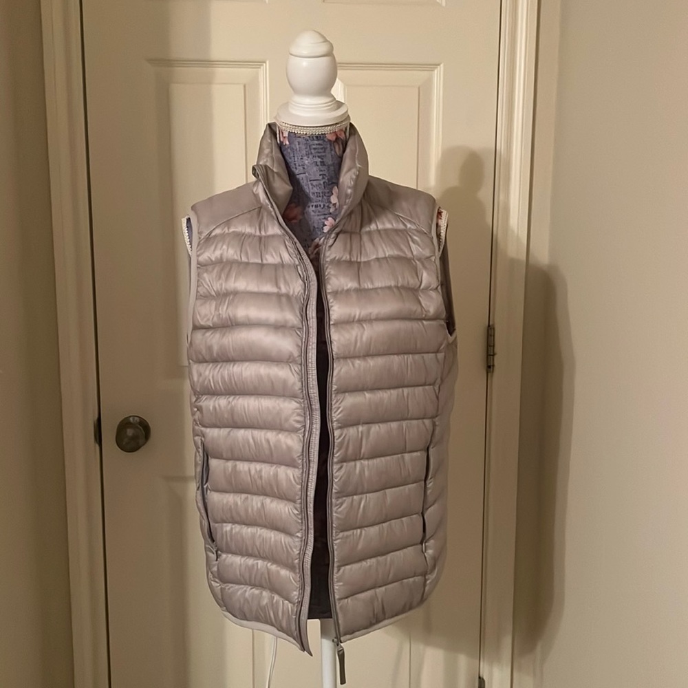 Light silver puffer vest.